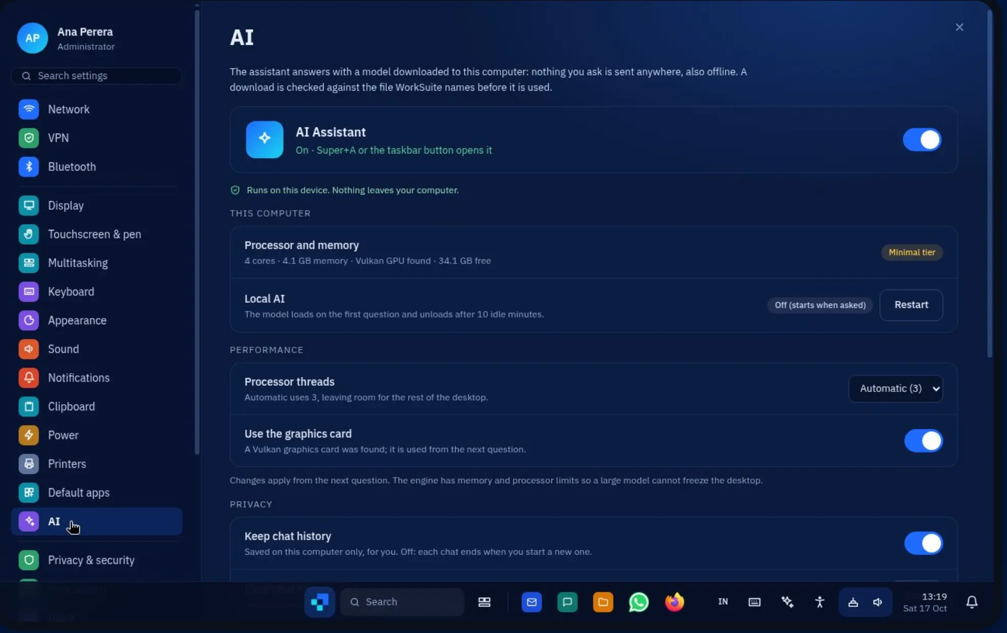 WorkSuite OS Settings AI panel showing the assistant toggle, the processor and memory this computer can offer, a local AI model that unloads when idle, processor thread and graphics card settings, and a keep chat history switch